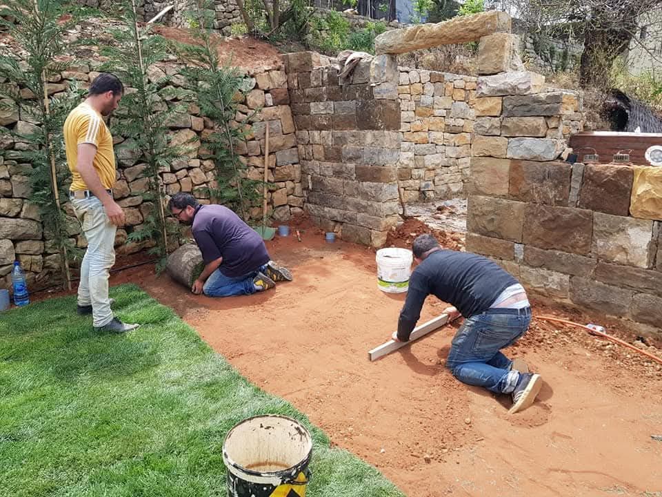 Before: terraced lawn with dry-stone wall